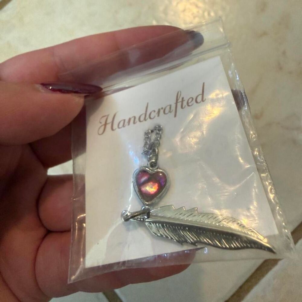 Handcrafted silver heart and feather pendant necklace